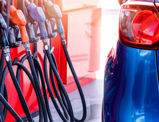 Are SUVs Really That Fuel Inefficient The Shift Toward Hybrid and Electric Models - blue SUV next to a gas pump