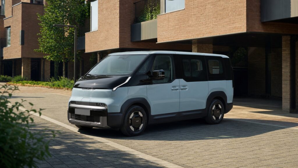 Kia PV5 electric passenger van in a contemporary urban setting
